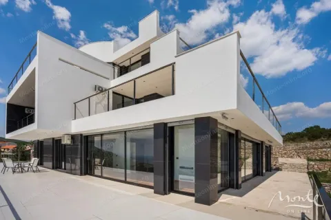 Exterior of a modern white house with terraces and large glass surfaces. - image 42