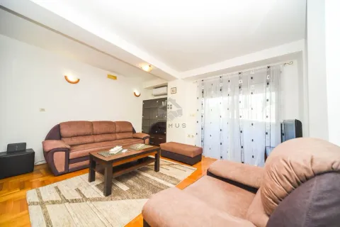 Living room with sofa set, coffee table and balcony access. - image 12