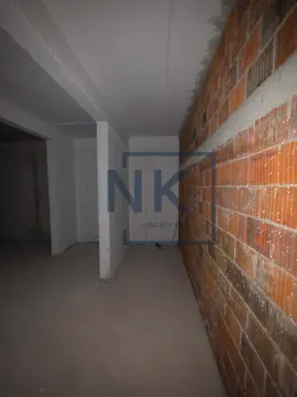 View of an unfurnished space in rough construction phase with an exposed brick wall. - image 14