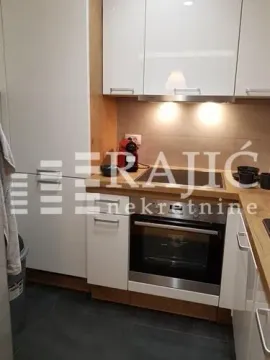 Modern kitchen with built-in units and appliances. - image 9
