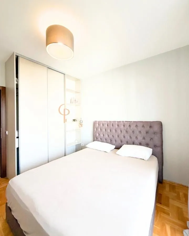 Bedroom with a double bed and a built-in wardrobe.