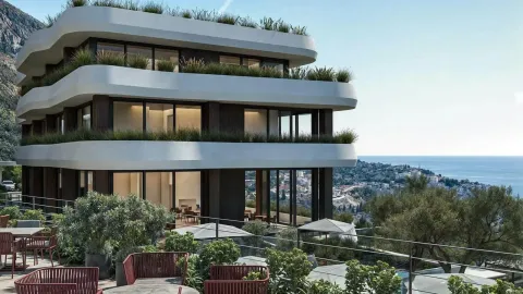 Pogled na spoljašnjost moderne stambene zgrade sa terasama i pogledom na more. - image 4