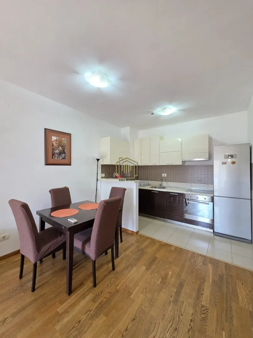 Kitchen with dining area featuring a wooden table and chairs.
