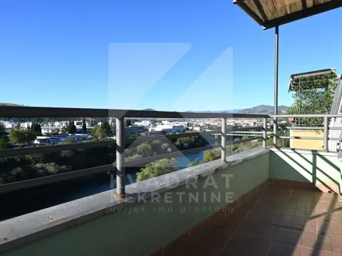 Balcony with a view of the river and surrounding area. - image 16