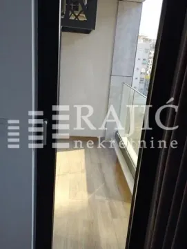 View of a small balcony with wooden flooring. - image 9