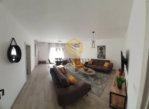 Spacious and bright living room with a sofa set and dining area. - image 2