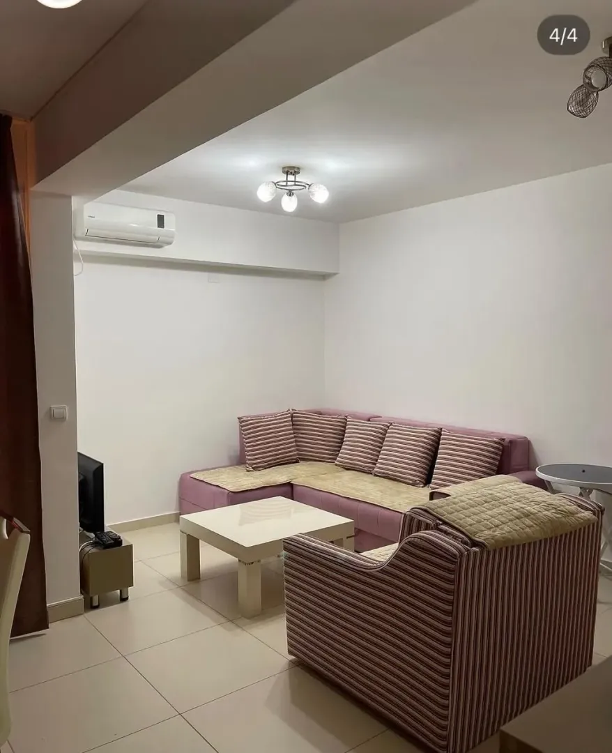 Living room with a sofa set and a coffee table.