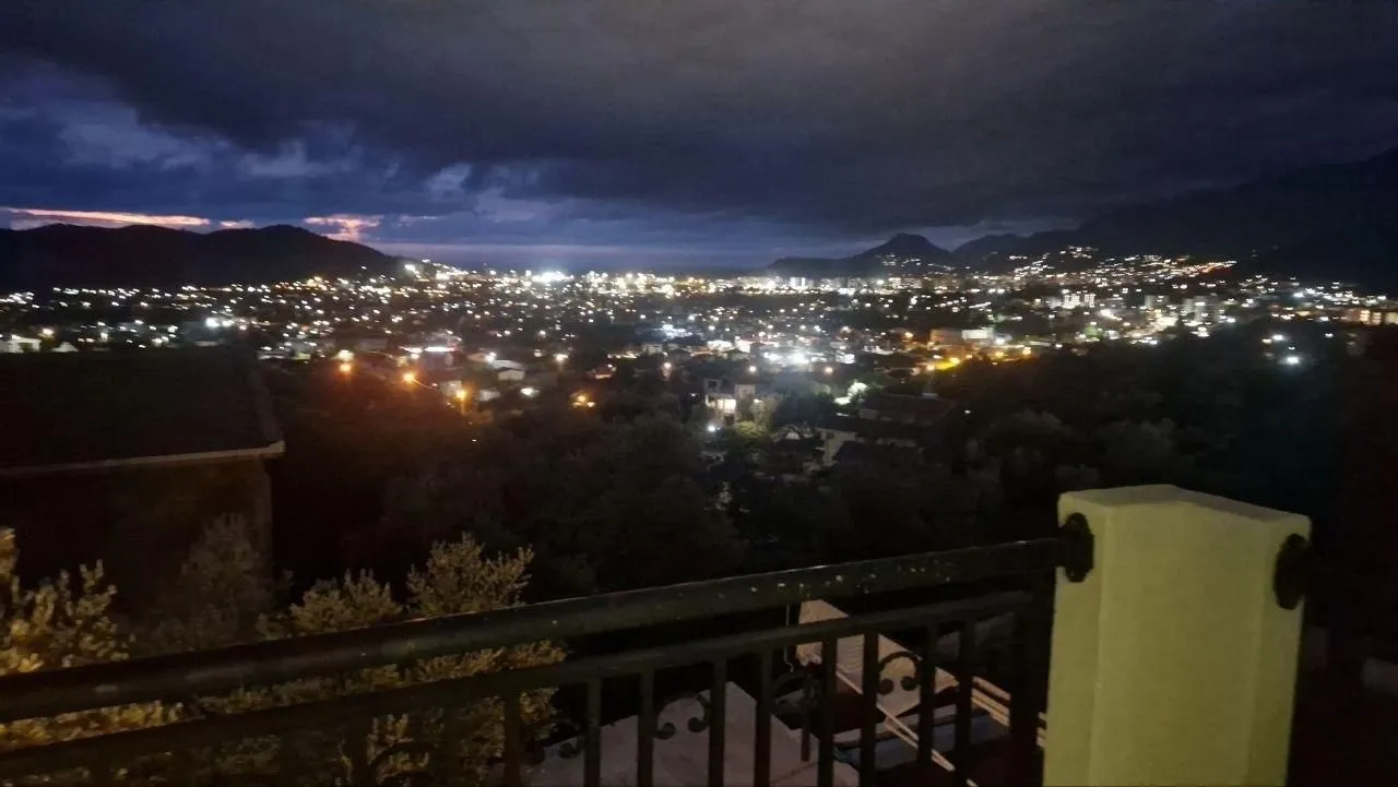 Night view of the illuminated city from the balcony.