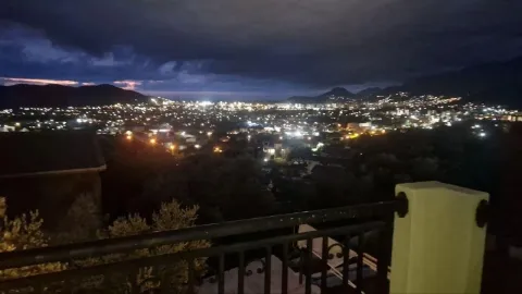 Night view of the illuminated city from the balcony. - image 2