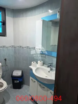 Smaller bathroom with a sink, cabinet, mirror, and toilet. - image 7