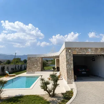 Exterior of the house with a swimming pool, yard, and garage. - image 14