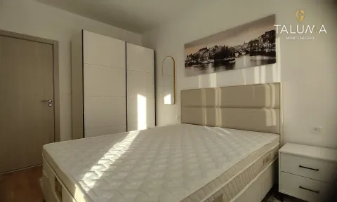 Bright bedroom with a double bed, large wardrobe and bedside table. - image 6