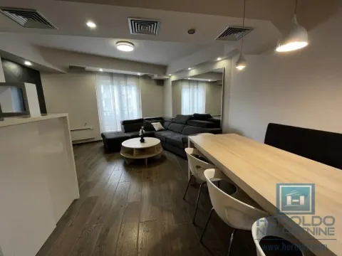 Living room with dining area and a corner sofa. - image 5