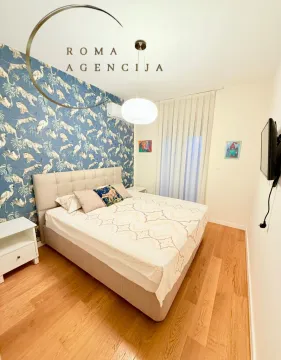 Modern bedroom with a double bed and patterned wallpaper. - image 4