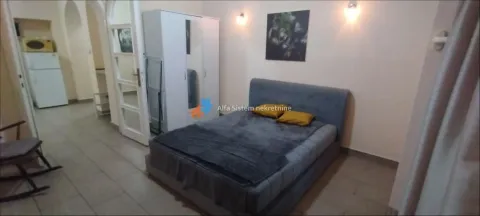Furnished bedroom with a double bed and a wardrobe. - image 14