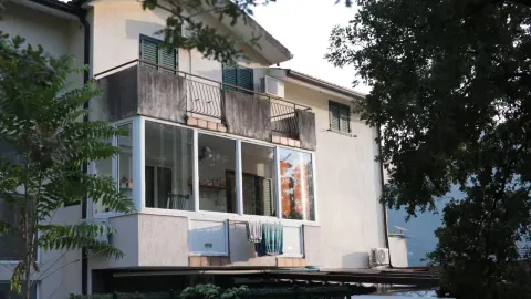 View of the exterior of the house with a balcony and a glazed terrace. - image 8