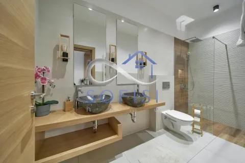 Modernly equipped bathroom with a double washbasin and a walk-in shower. - image 20