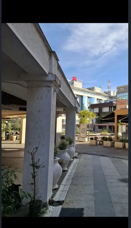 View of the exterior area and building entrance with columns.