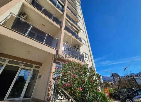 Exterior of a residential building with balconies and an entrance. - image 11