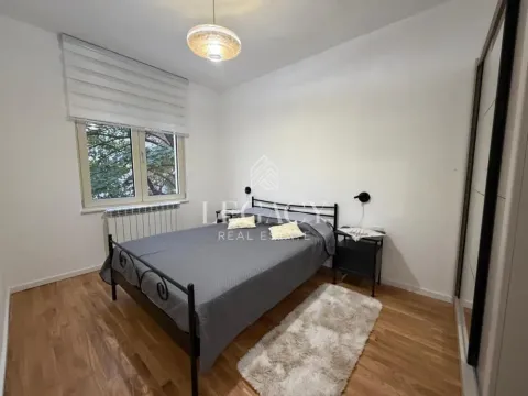 Furnished bedroom with a double bed, wardrobe, and window. - image 17