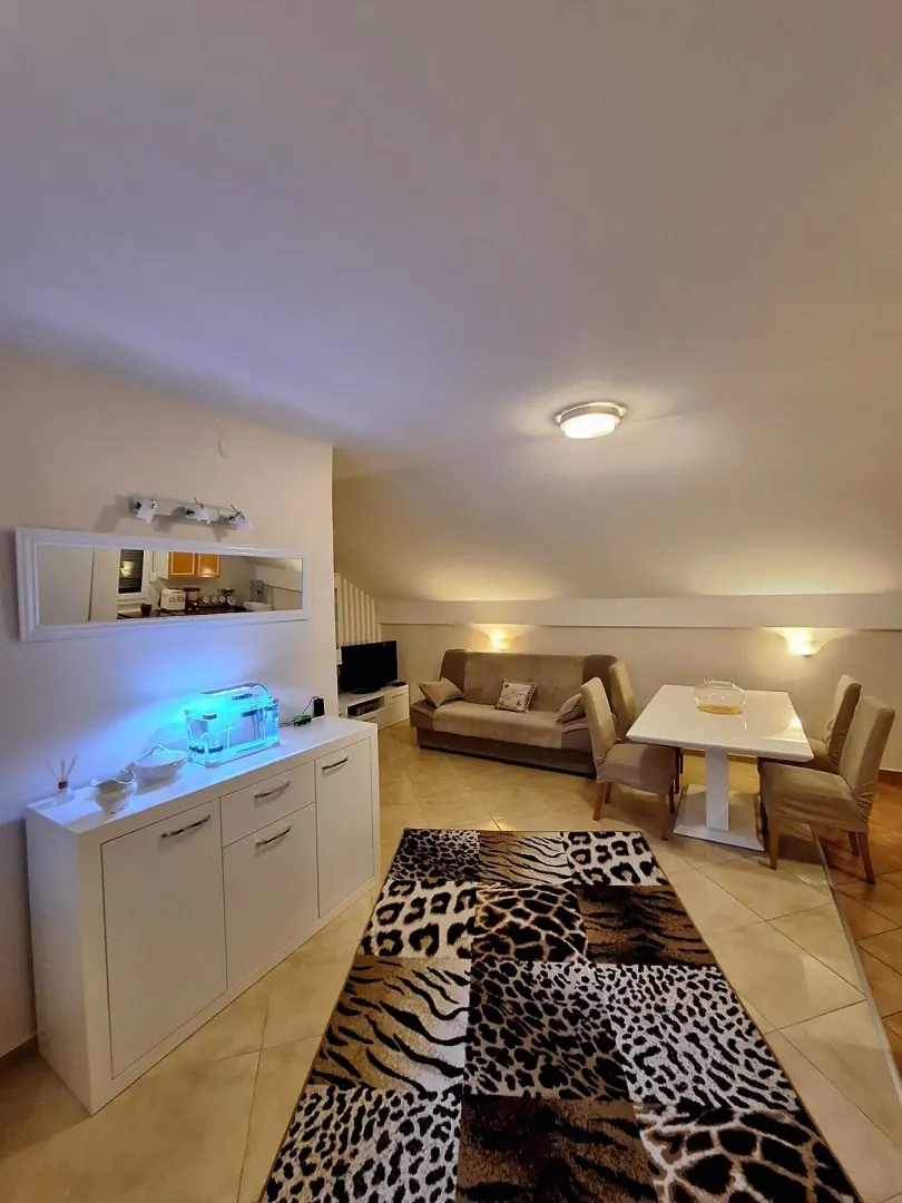 Living room with dining area in an attic.
