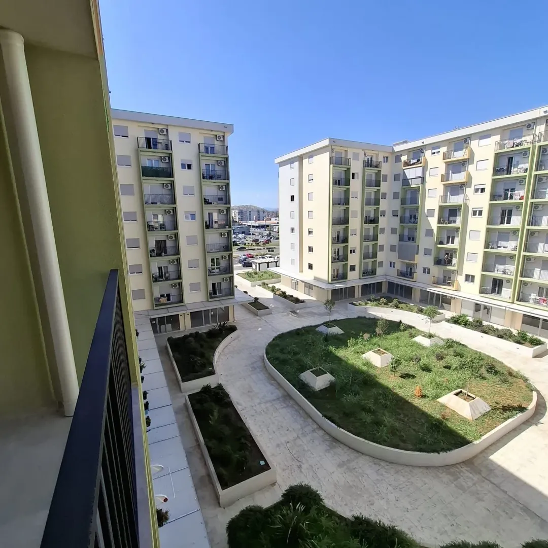 View from the terrace overlooking the courtyard and residential buildings.