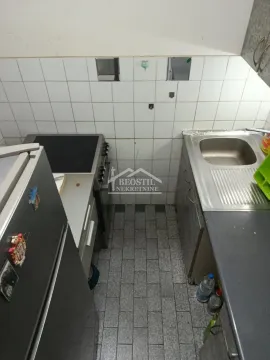 Smaller kitchen with a stove, refrigerator, and sink. - image 12