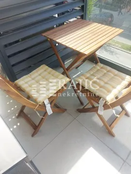 Small wooden furniture set with a table and two chairs on the terrace. - image 8