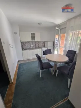 Kitchen with dining area and access to the terrace. - image 5
