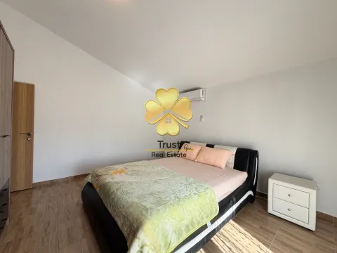 Bedroom with a double bed, white walls, and a wardrobe. - image 14