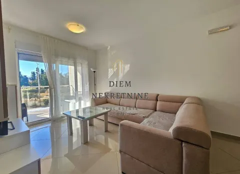 Living room with a sofa and access to the terrace. - image 2