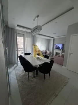 Dnevna soba sa trpezarijom i modernim nameštajem. - image 7