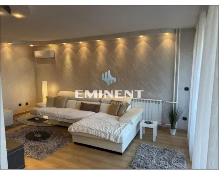 Comfortable living room with a sectional sofa and decorative lighting. - image 2
