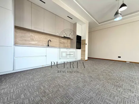 Modern kitchen within a bright open-plan space with carpeted flooring. - image 5