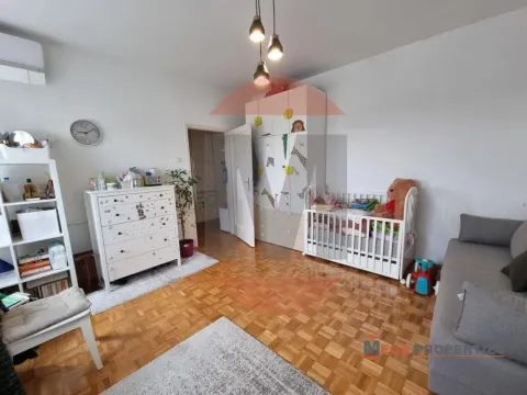 Children's bedroom with a crib, wardrobe, and chest of drawers. - image 2