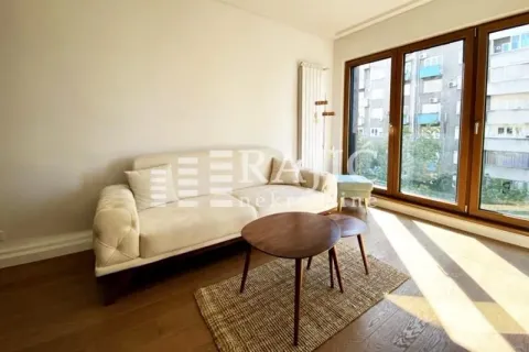 Living room with sofa and large windows. - image 3