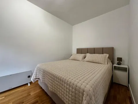 Bedroom with a double bed and a nightstand. - image 4