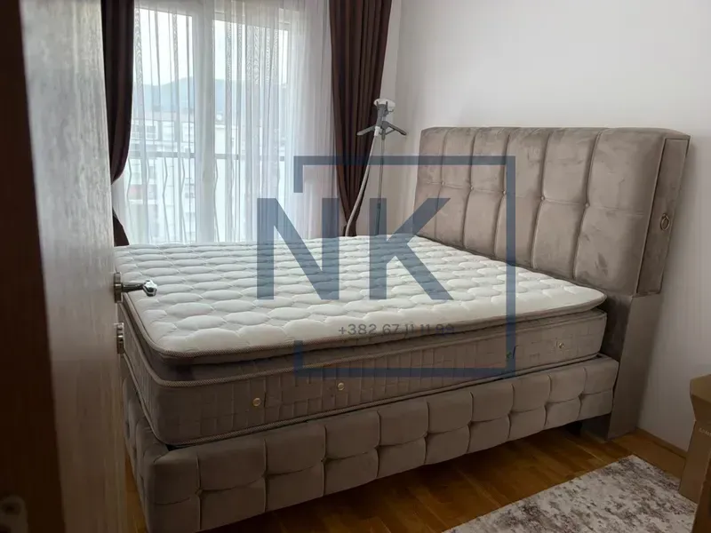 Furnished bedroom with a double bed.