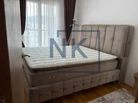 Furnished bedroom with a double bed. - image 4