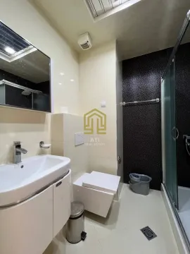Modern equipped bathroom with a shower cabin. - image 9