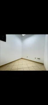 Empty room with white walls and tiled floor. - image 4