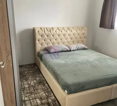 Bedroom with a double bed featuring an upholstered headboard. - image 11