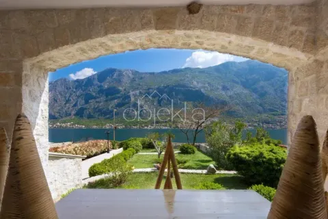 View of the sea and mountains from a covered stone terrace. - image 10
