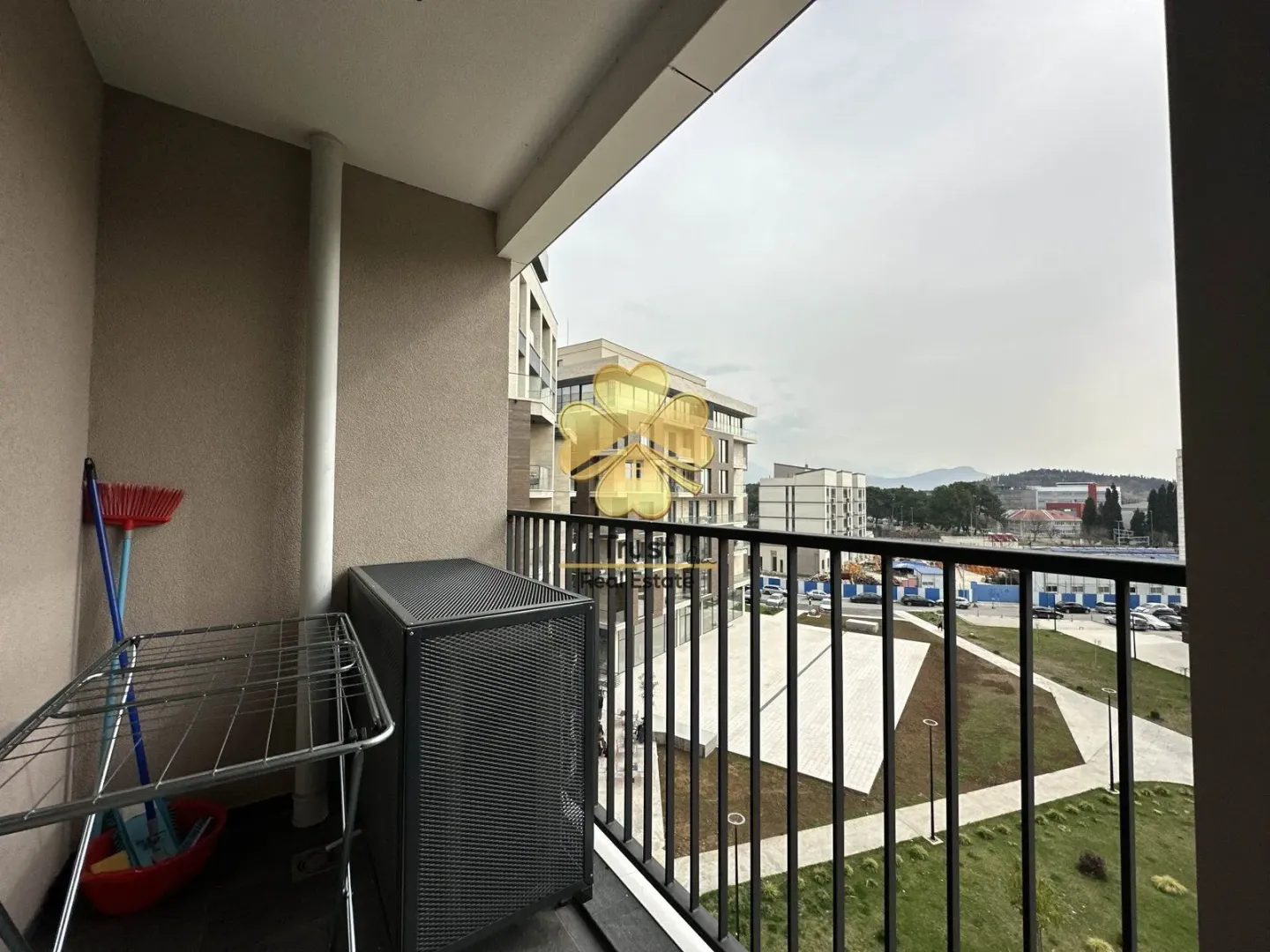 Balcony with a drying rack and a view of the neighborhood.