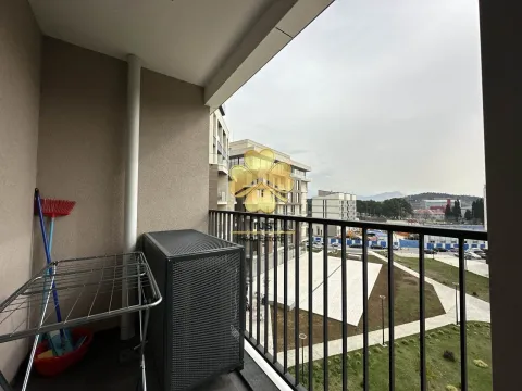 Balcony with a drying rack and a view of the neighborhood. - image 7