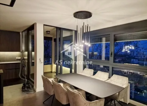 Modern dining room with a large table, comfortable chairs, and large windows. - image 19