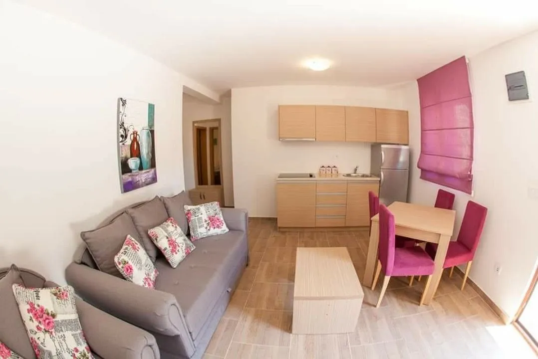 Living room with kitchen and dining area.
