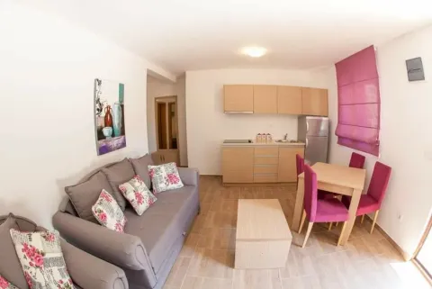 Living room with kitchen and dining area. - image 3
