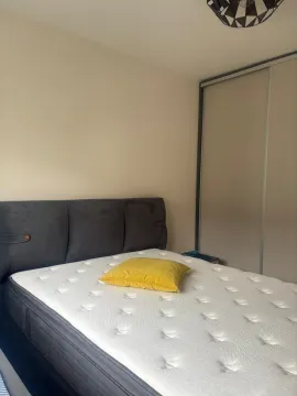 Bedroom with a double bed and a fitted wardrobe. - image 4