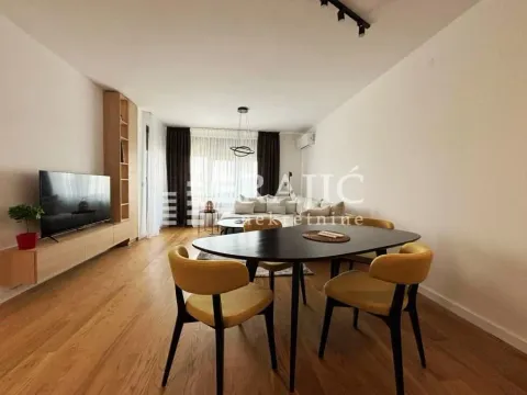 Living room with a dining area and modern furniture. - image 2